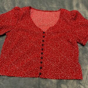 Red polka dot shirt. About pant waist length.Never worn